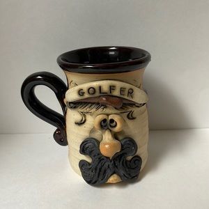 Hand crafted pottery face mug “golfer” signed by artist